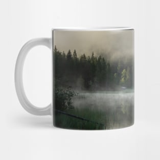 Misty Lake 2. Amazing shot of a wooden house in the Ferchensee lake in Bavaria, Germany, in front of a mountain belonging to the Alps. Scenic foggy morning scenery at sunrise. Mug